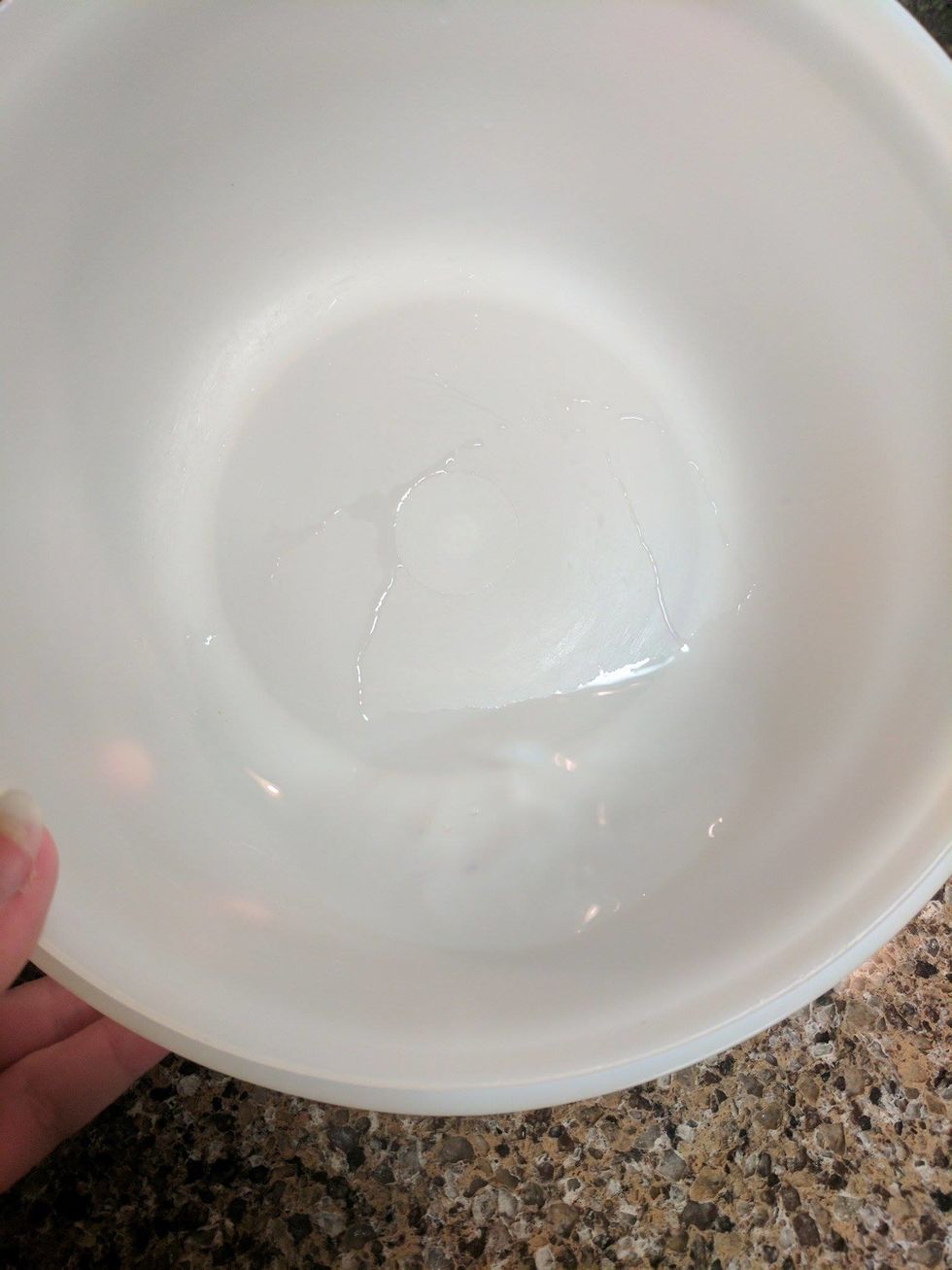 Measure a 1/4 cup of water and pour into the mixing bowl.
