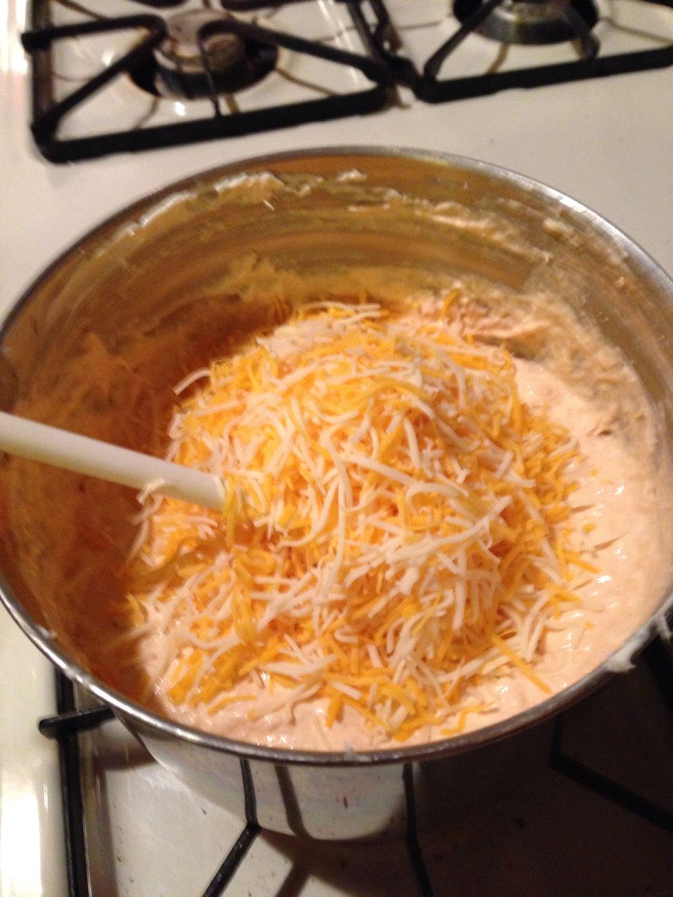 Measure a cup and a half of shredded cheese and add to your pan.
