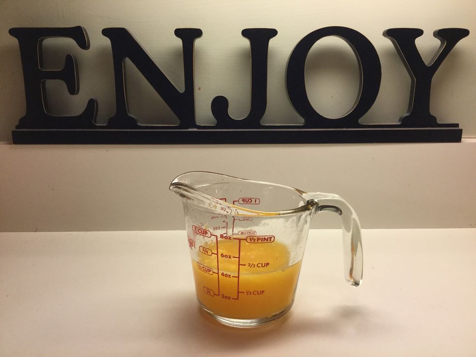 Measure a half a cup of orange juice