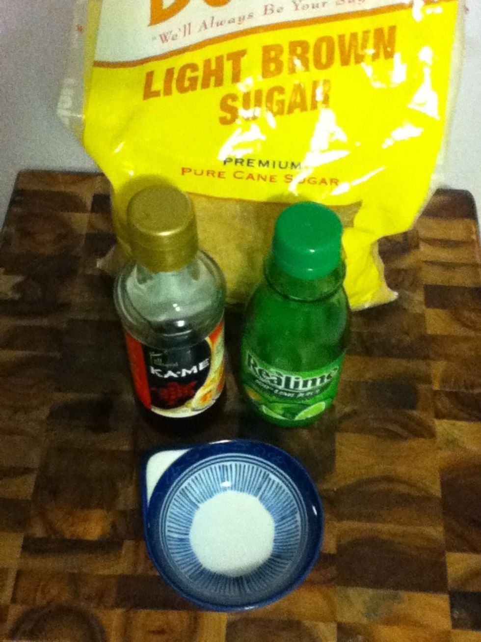 Measure a quarter cup of brown sugar and have it ready by the stove. Combine the 2 tbsp each of fish sauce and lime juice and have that ready to go, too.