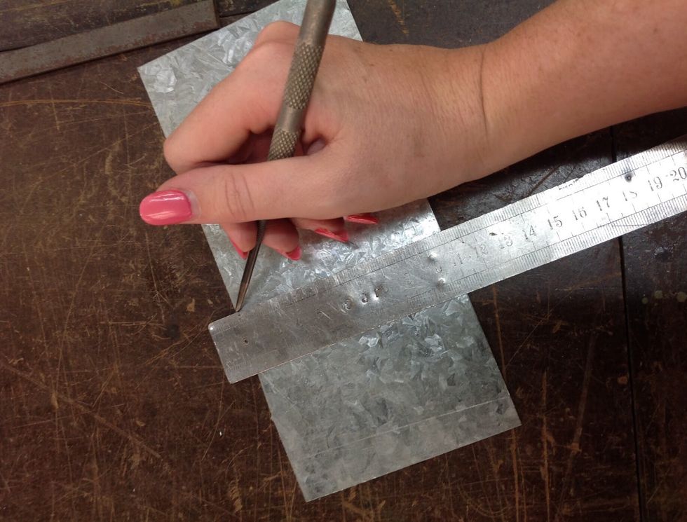 Measure a square with a ruler using a scribe to mark it
