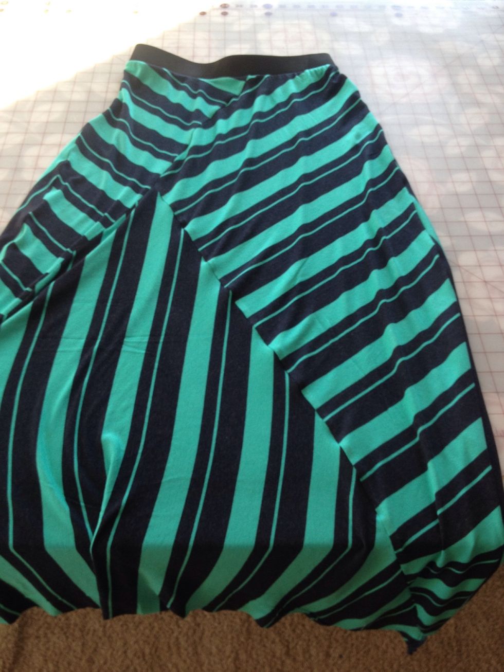 Measure a waist band for yourself and sew it to the skirt.