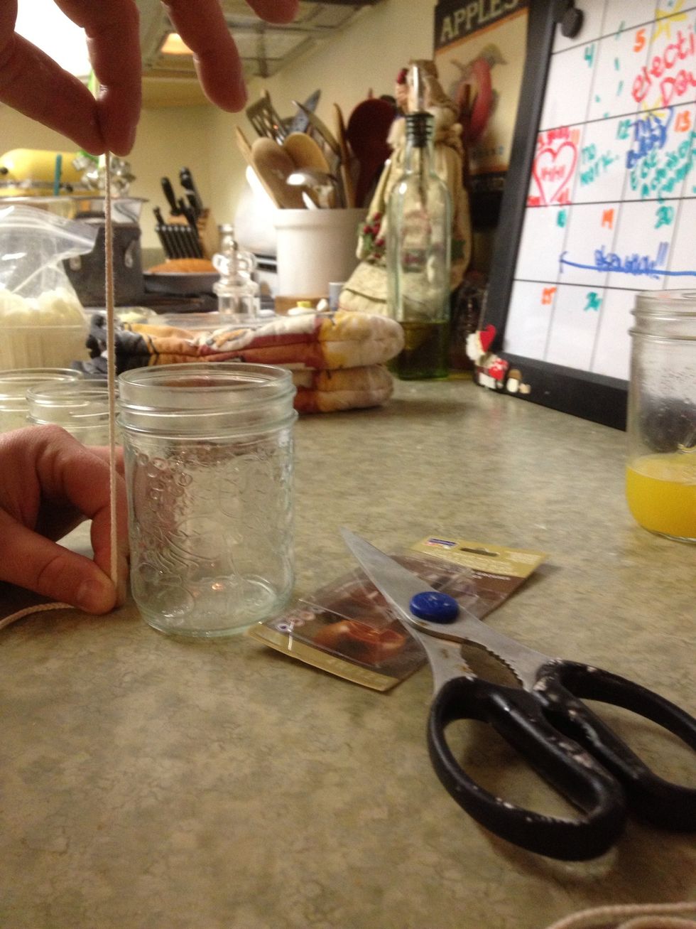 Measure and cut your wick to fit a few inches longer than the length of the mason jar. You wicks should be 100% unbleached cotton.