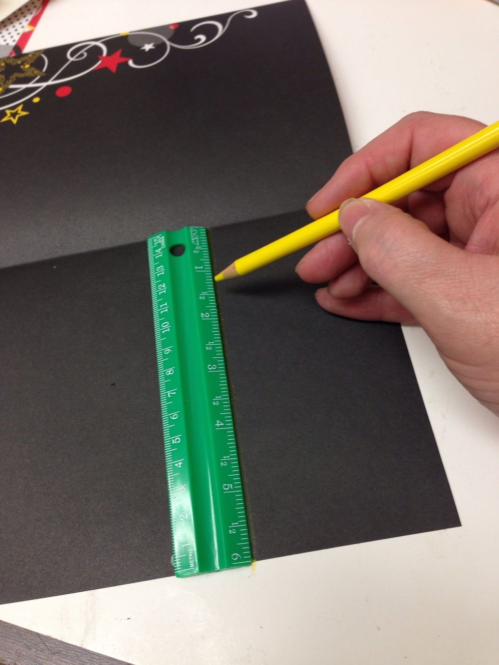 Measure and mark a 3 inch strip on both sides of the lower half of your card stock. You may also use our template to trace the cutting lines. Download here: http://goo.gl/AAipCZ
