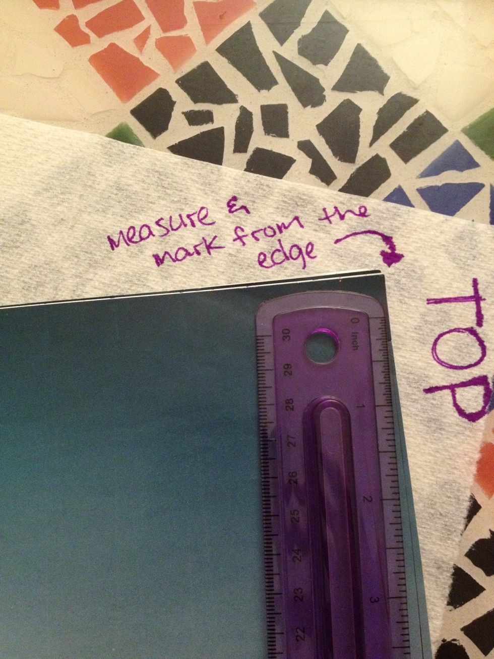 Measure and mark each half inch at the top of the paper, starting from the edge of the paper.