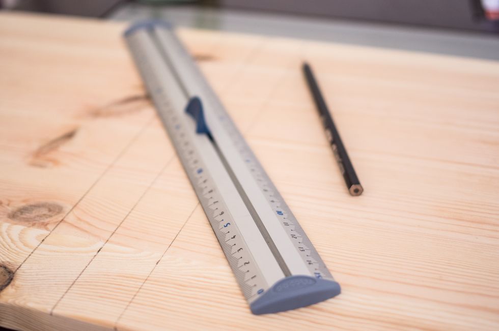 Measure and mark off 20cm (7.9") for the small hexagons and 30 cm (11.8") for the large ones. I have marked 3cm(1.18") from each side of the main line, so that it is easier to saw the straight line