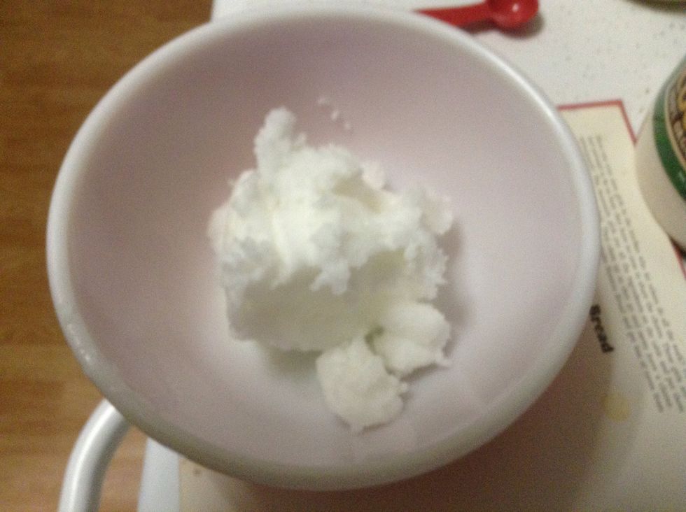 Measure coconut oil in a small microwave safe bowl