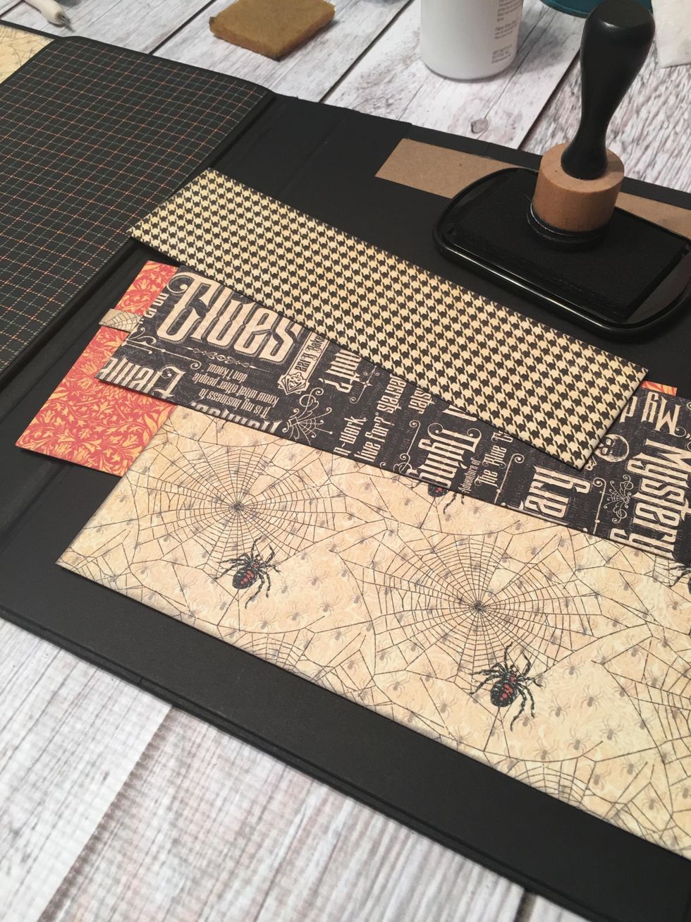 Measure, cut and ink patterned papers to cover the three pocket sections.