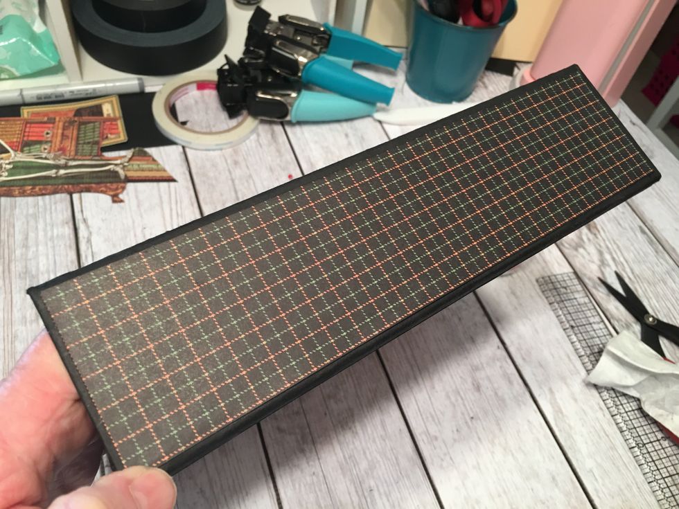 Measure, cut, ink and adhere patterned paper to the outside spine area of your album.