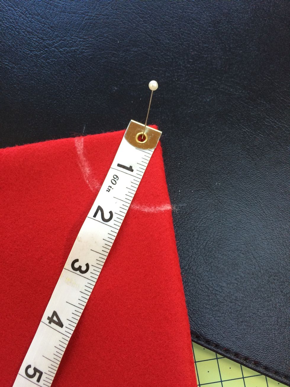 Measure down 1.5 inches from point for neck opening