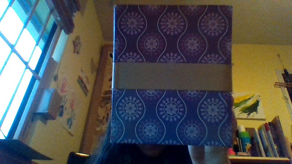 Measure how much ribbon you need to go all around the tissue box, and then cut it. Make sure you have a little bit of slack at one of the ends (you'll need it later..!)