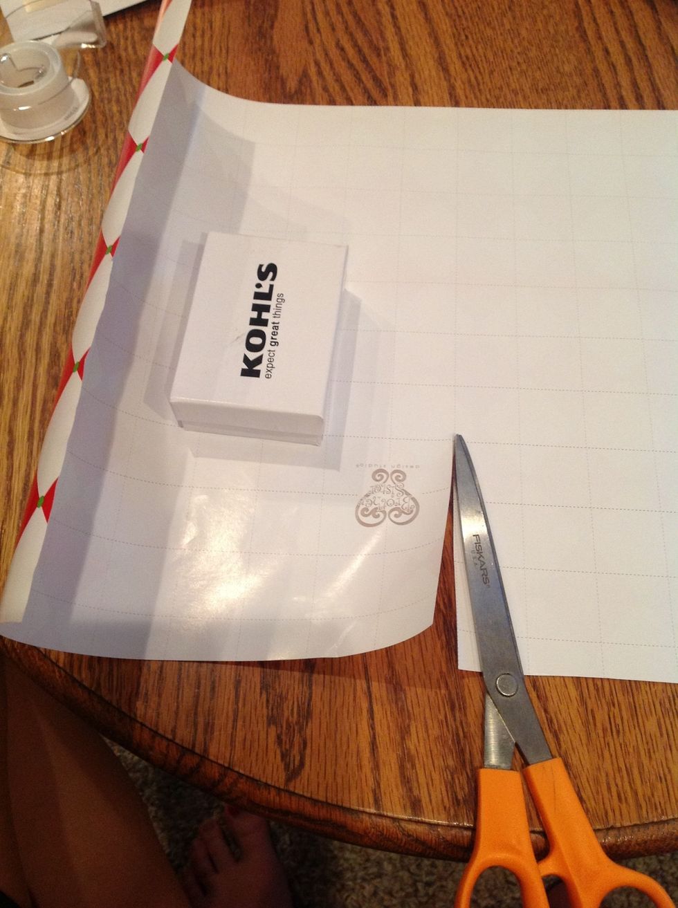 measure how much you need so that the present will be fully covered and cut the paper