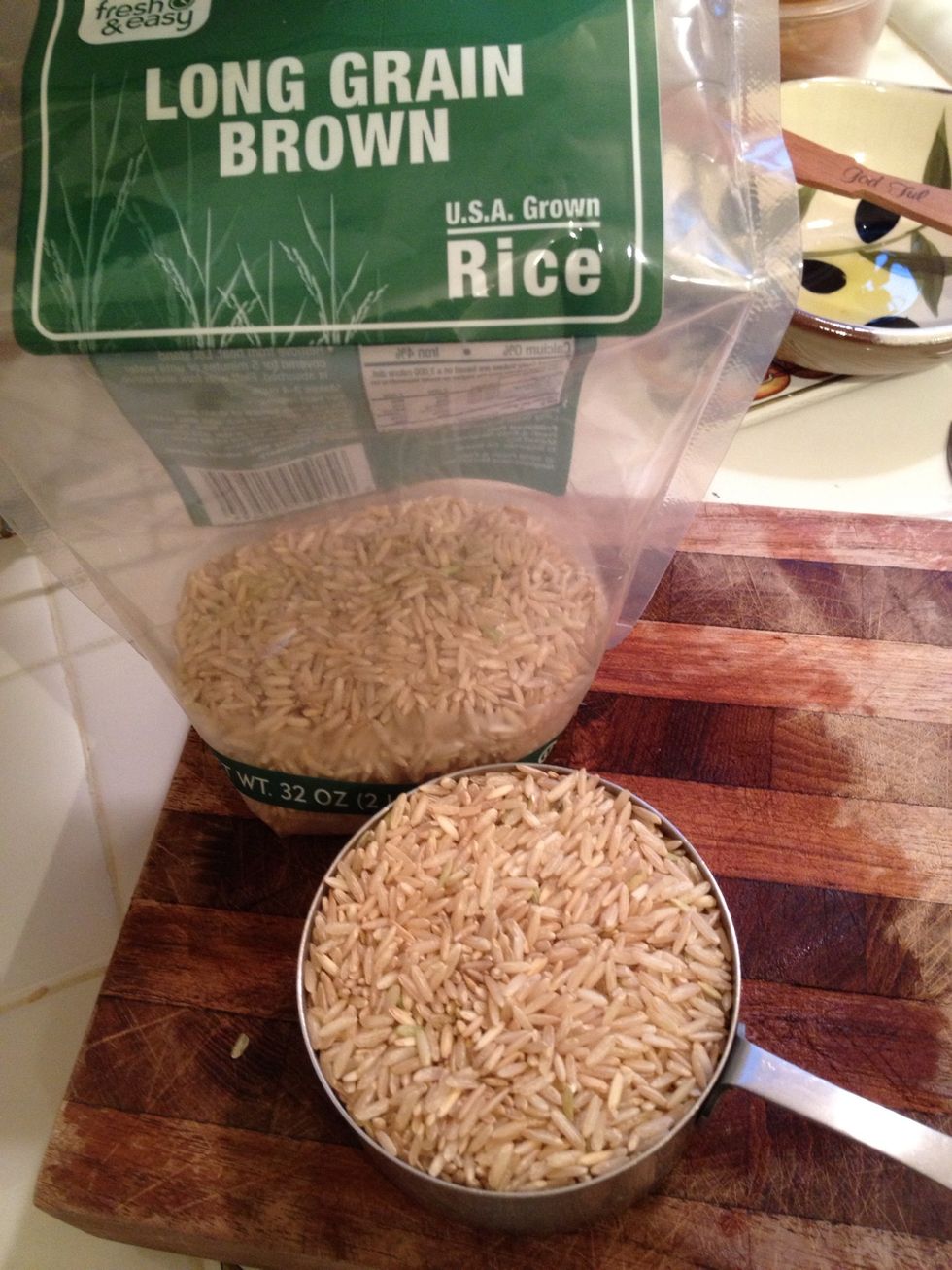 Measure in two cups of long grain brown rice. Mix it in with the onions and brown it a little. This will give the rice another dimension of flavor.