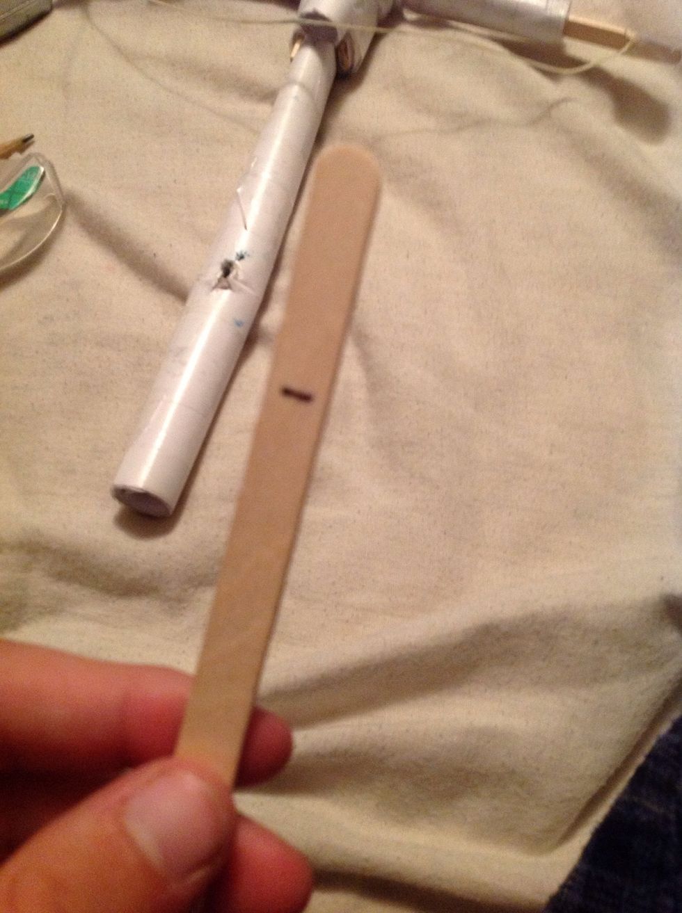 Measure like an inch and a half down the one end of a popsicle stick.
