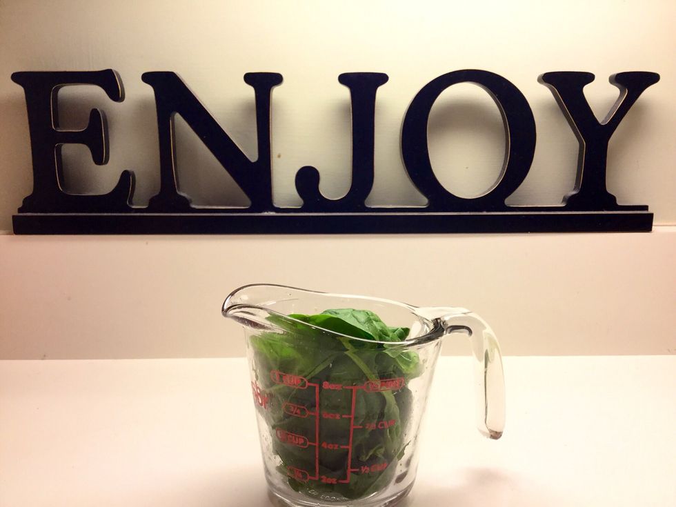 Measure one cup of baby spinach leaves