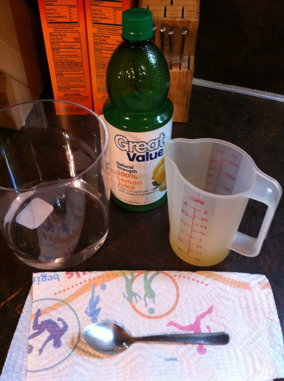 Measure out 1/2 cup Lemon Juice, pour into Container.