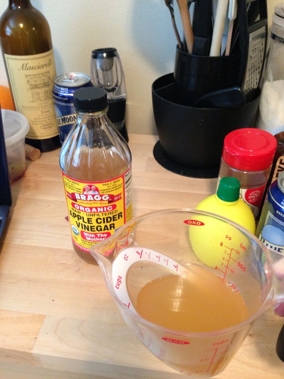 Measure out 1/2 cup of apple cider vinegar and add to a bowl.