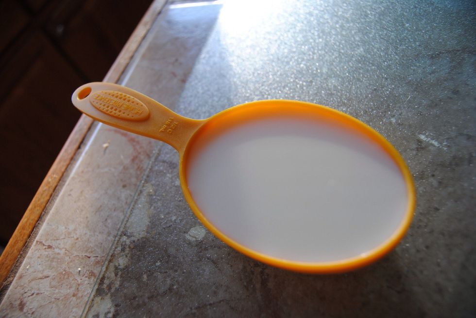 Measure out 1/2 cup of Milk and add to the pot