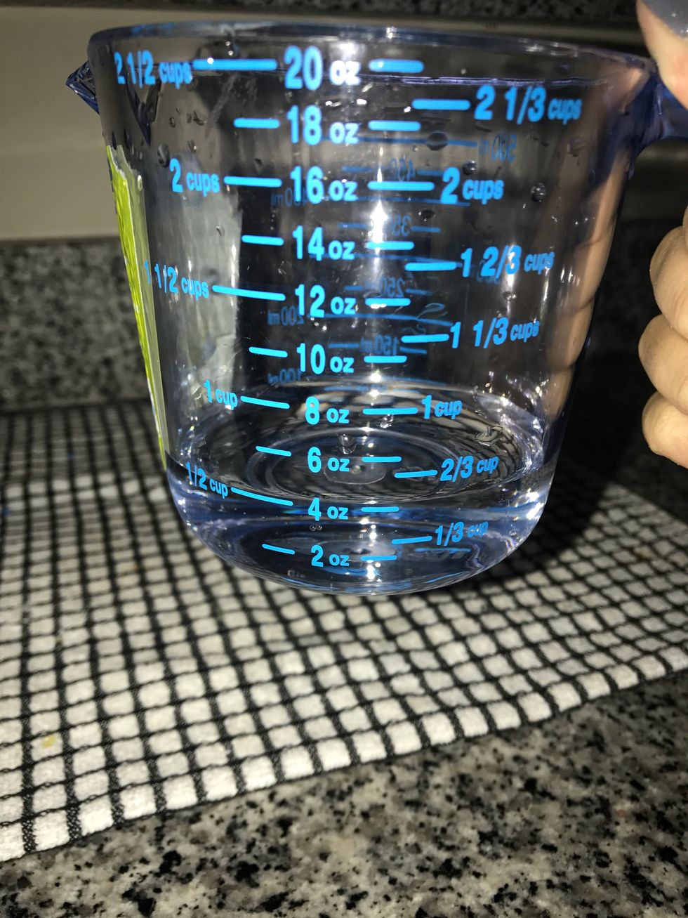 Measure out 1/2 cup of water.