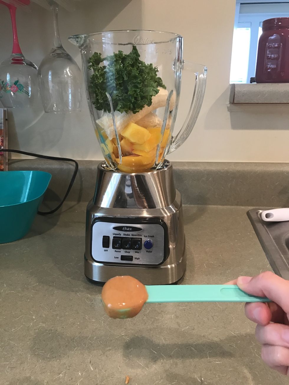 Measure out 1/2 tbsp of peanut butter and add it to the blender