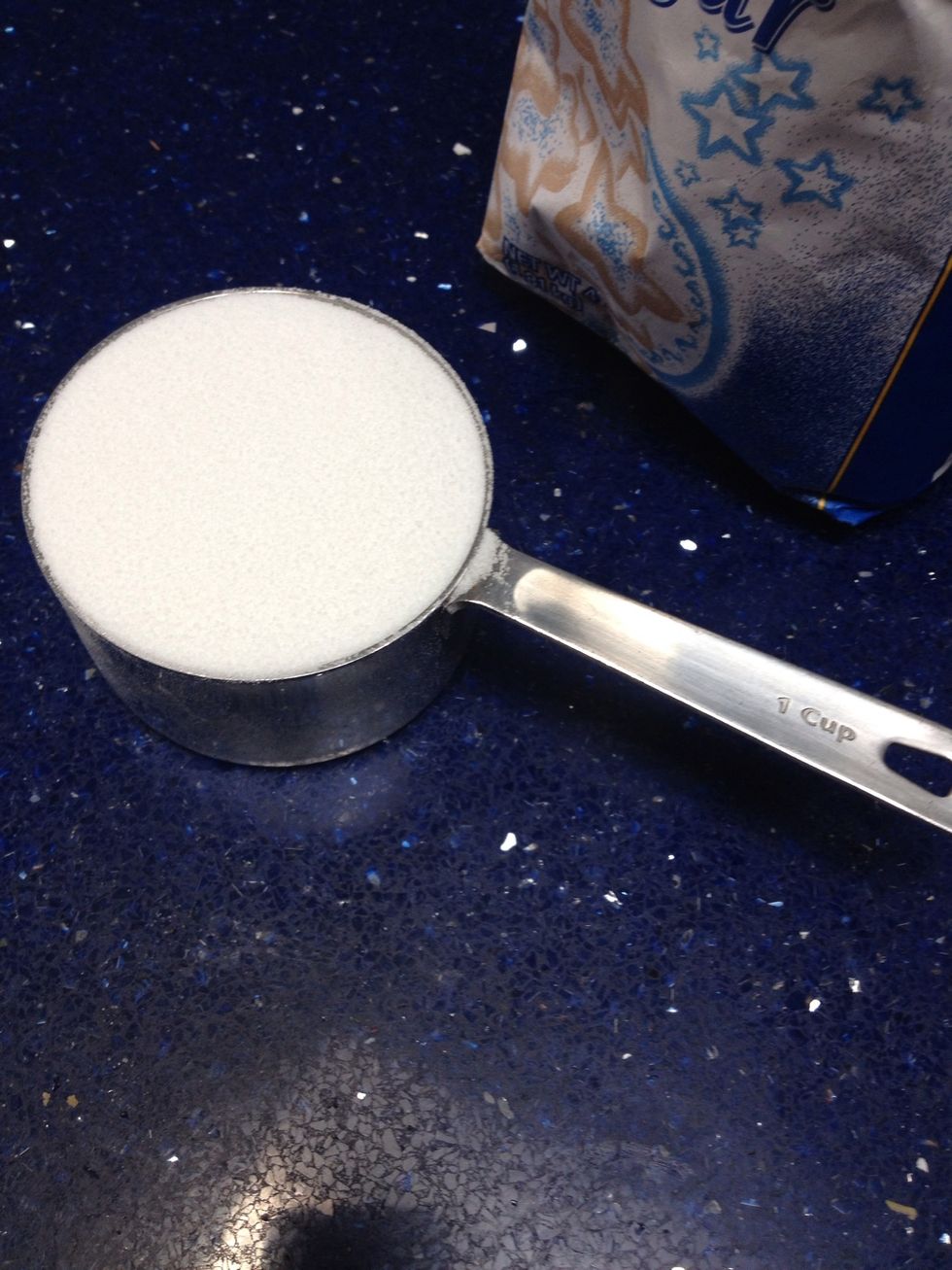 Measure out 1 cup of sugar and add this into the mixing bowl with the cream cheese.