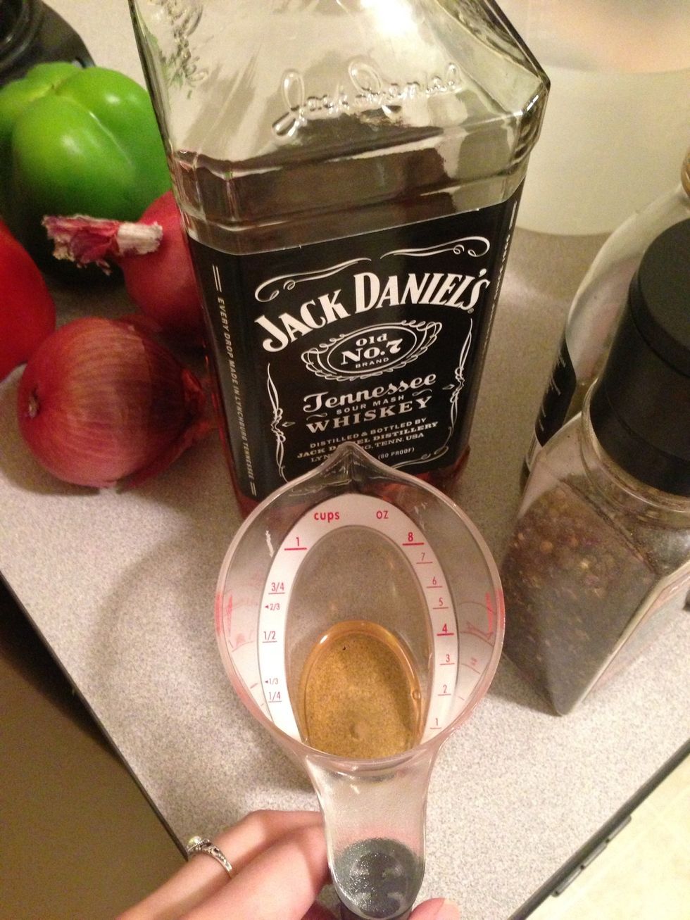 Measure out 1 oz of Jack Daniels or your favorite whiskey. You can either put this in the marinade or put it on the grill with the chicken. You can also leave this out.