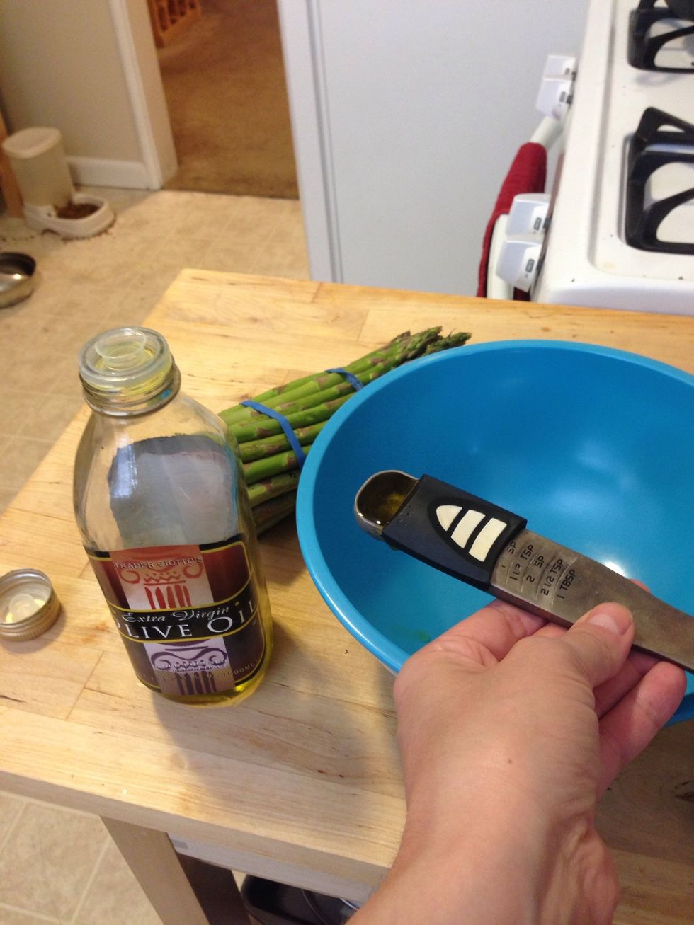 Measure out 1 tsp of olive oil and put it in a container.