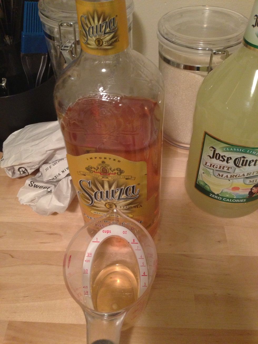 Measure out 2 oz of tequila.