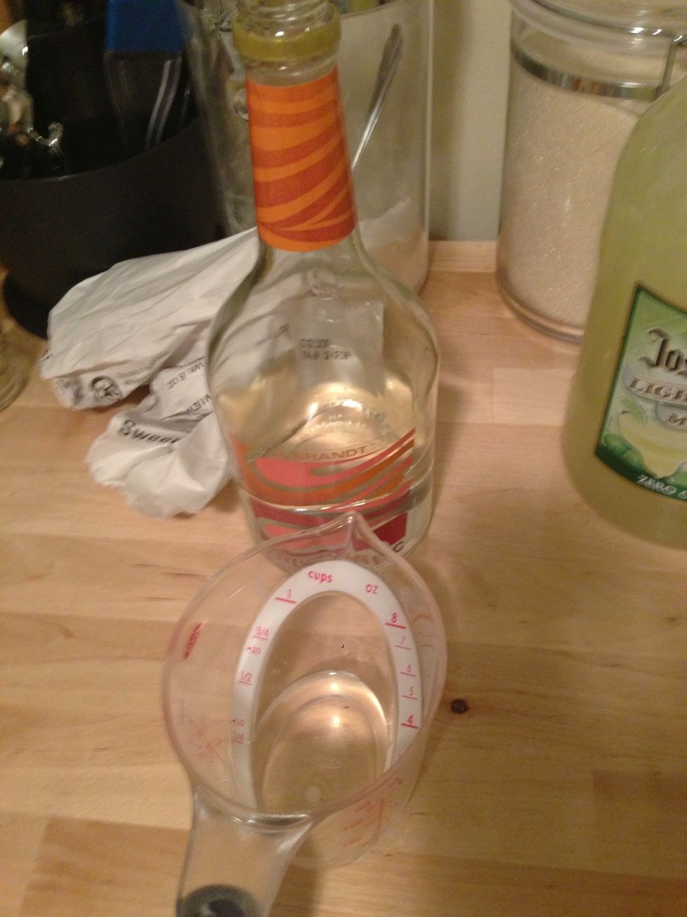 Measure out 2 oz of triple sec.