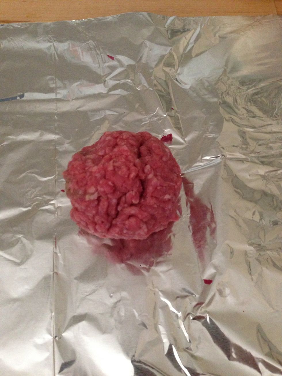 Measure out ~4 oz of beef and roll it into a ball.