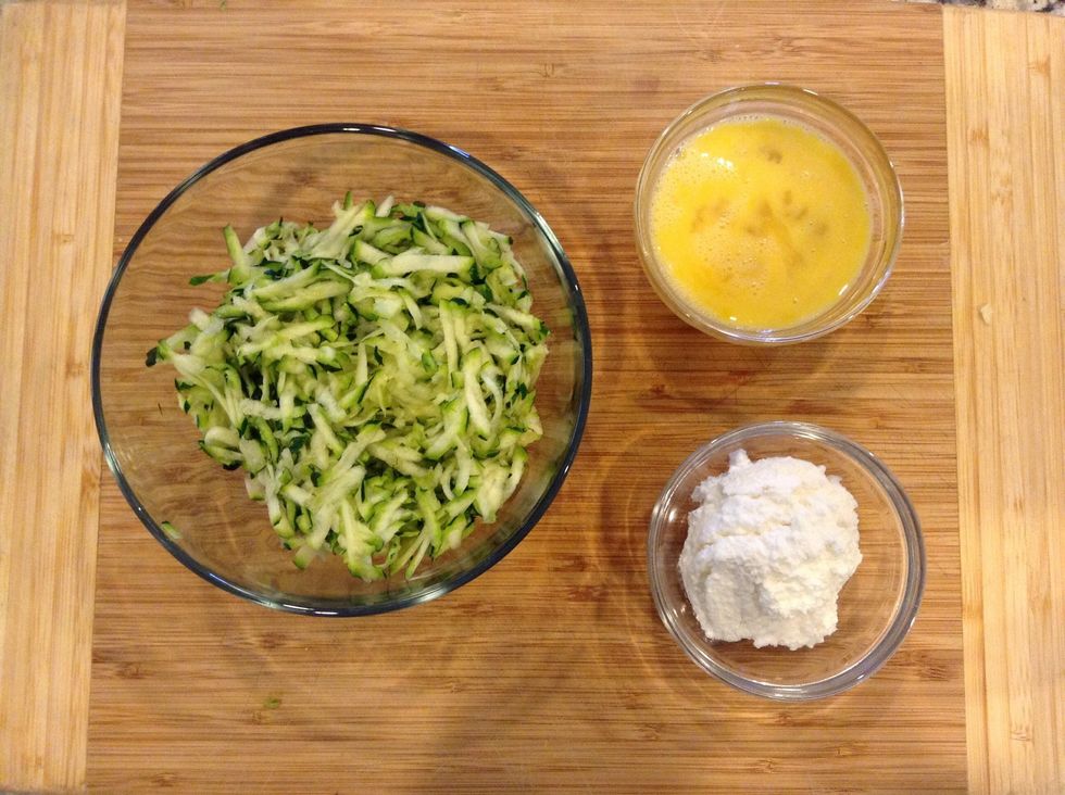 Measure out cheese and mix egg