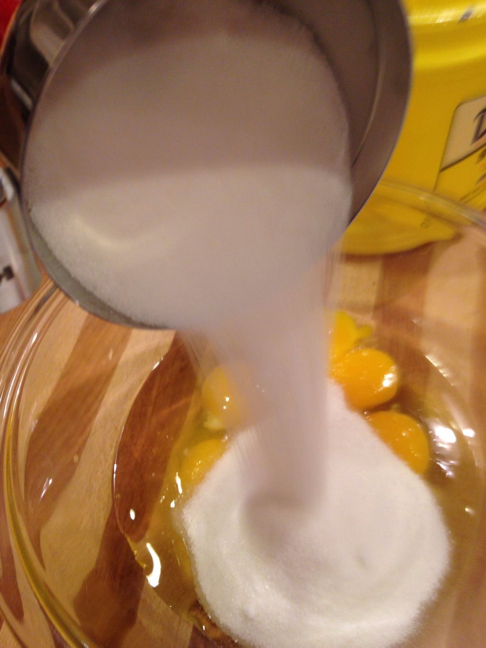 measure out one cup of granulated sugar and add to the bowl.