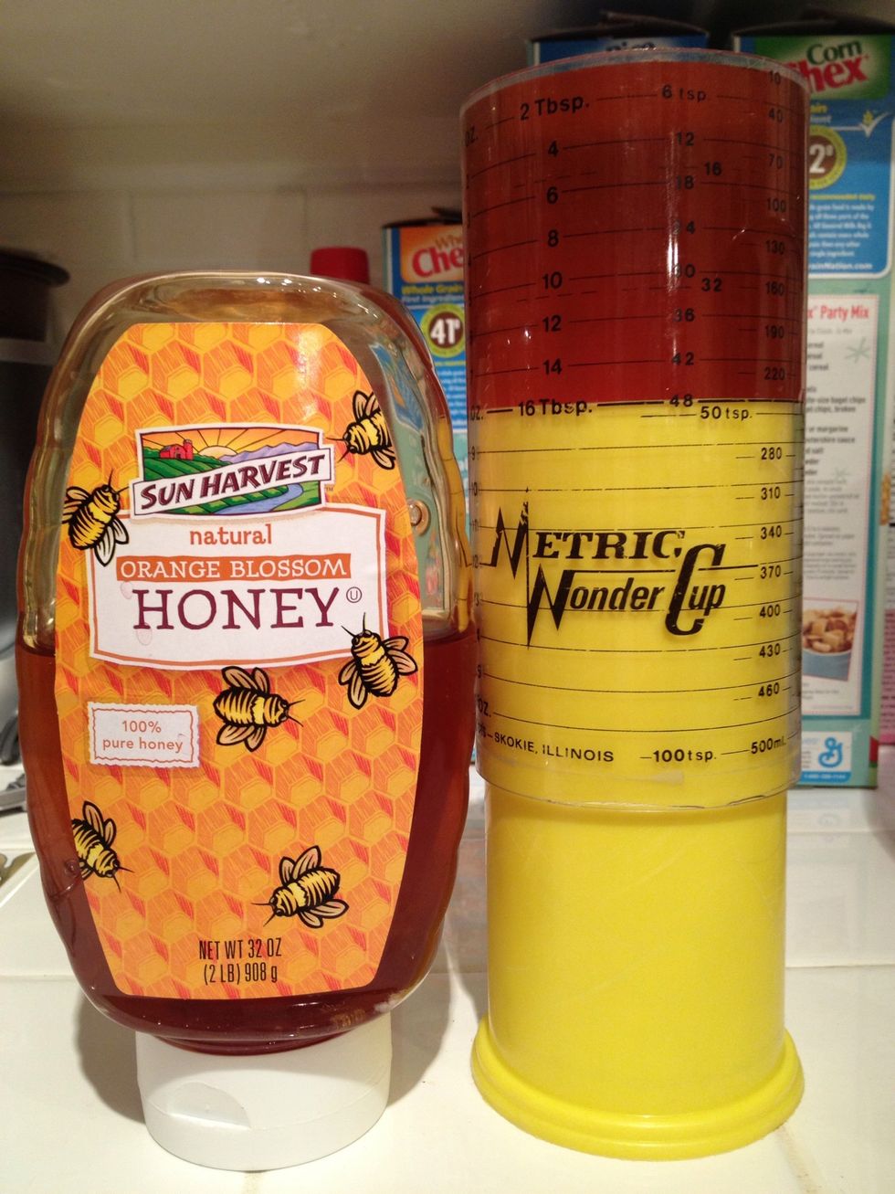 Measure out one cup of honey into a saucepan. I like this kind of measuring cup, because it's easy to push the honey out and it wastes less. Pampered Chef sells them.
