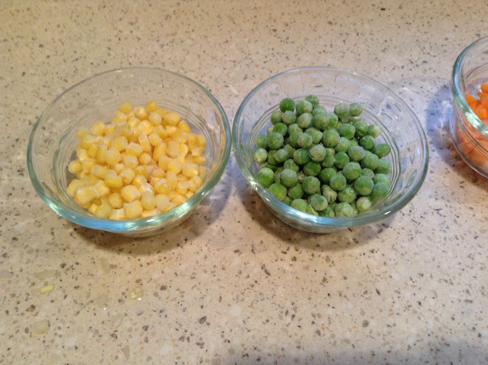 Measure out the frozen peas and frozen corn and set aside