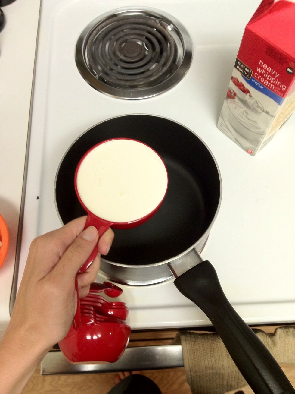 Measure out your 2 cups of heavy cream, into the saucepan they go. Heat the cream on MEDIUM TO LOW heat - you do NOT want to boil it. This will cause your panna cotta to separate.