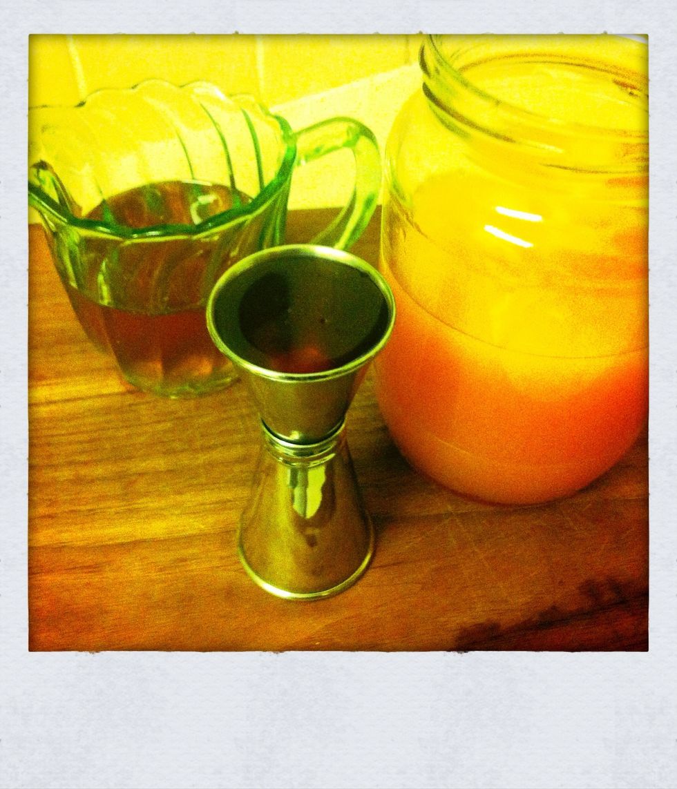 Measure out your syrup and pour in last. You will need to give this a good stir as the syrup will sink to the bottom. You can find the syrup in our guide on festive line and cardamom syrup.