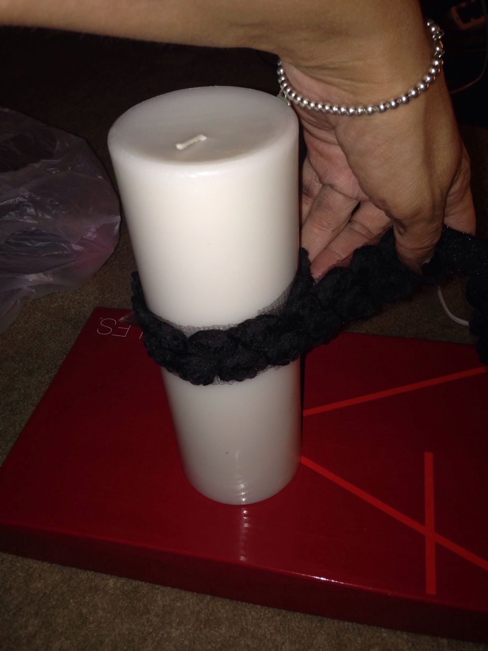 Measure ribbon around candle