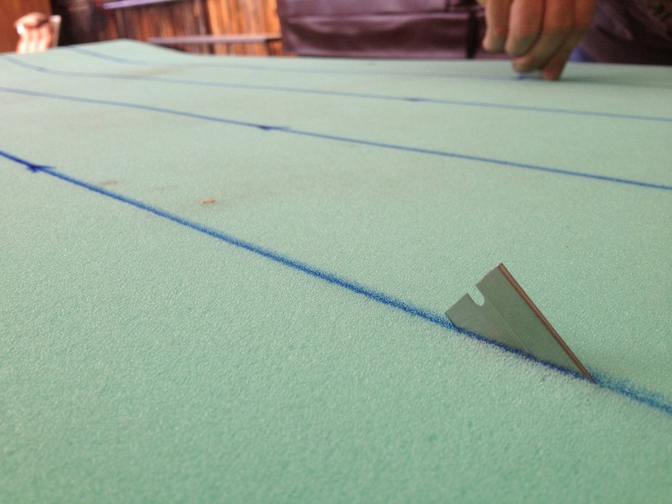 Measure the 1" foam sheet into 5" strips to match your rail. Cut the strips carefully with a razor.