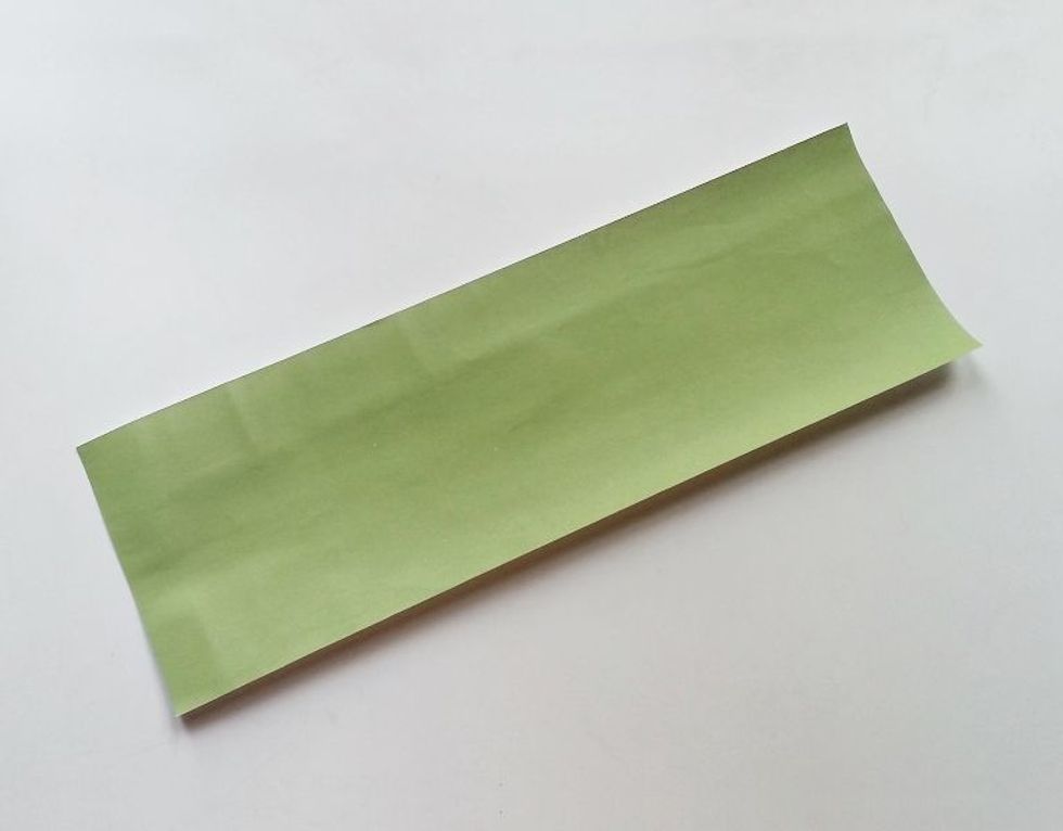 Measure the can size and cut out a long strip of craft paper to wrap the can once. Keep half an inch extra on the paper along the width.