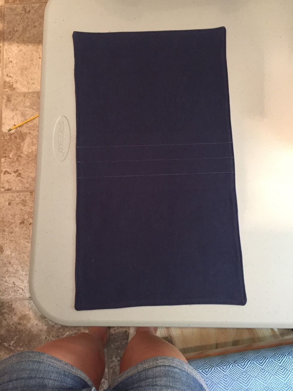 Measure the center (approx 9") and draw a line across the short way to mark where handle will go. Measure 1" out on either side and draw a line. Then top stitch the two outside lines.