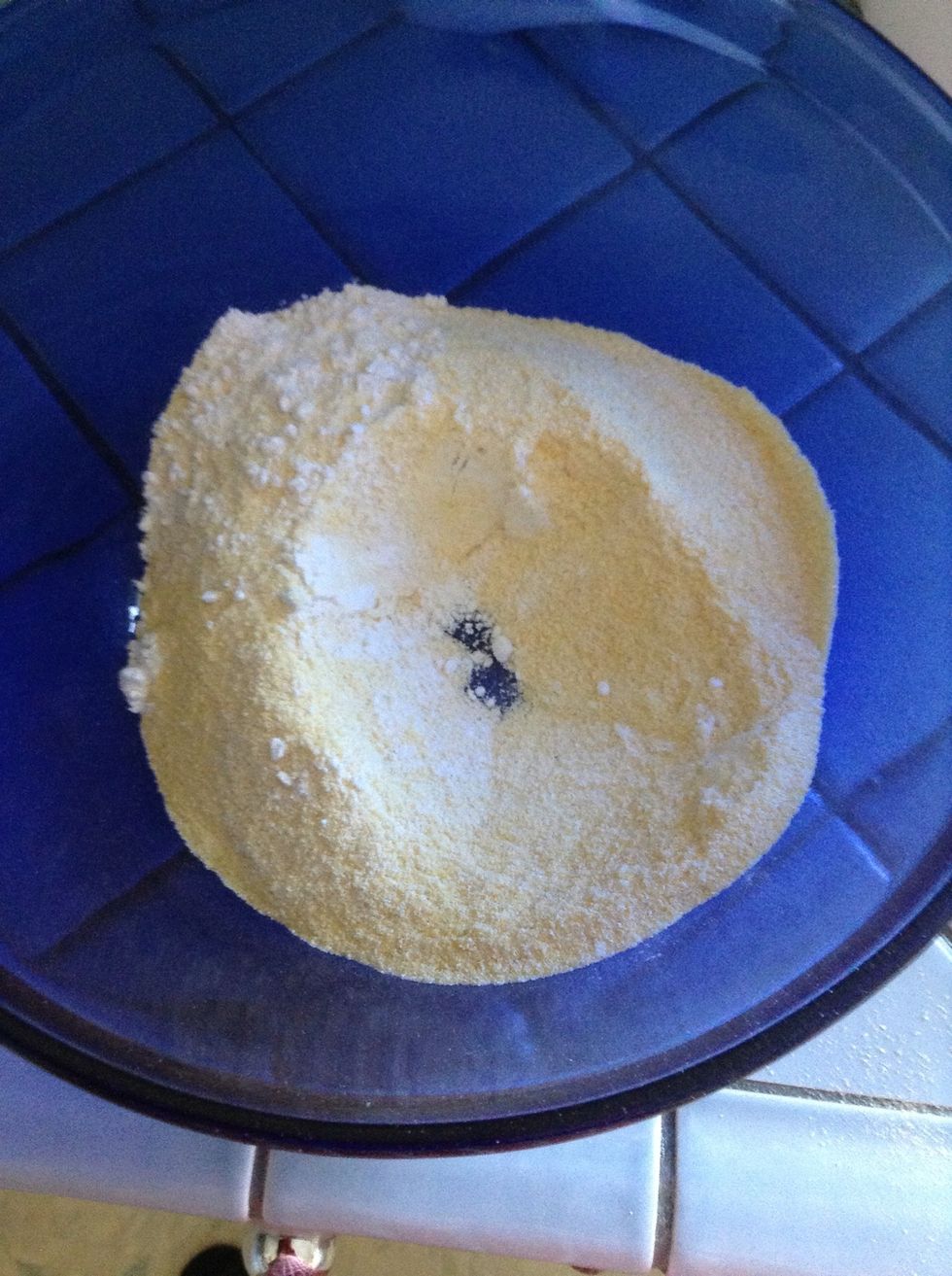 Measure the cornmeal and flour into a large bowl.