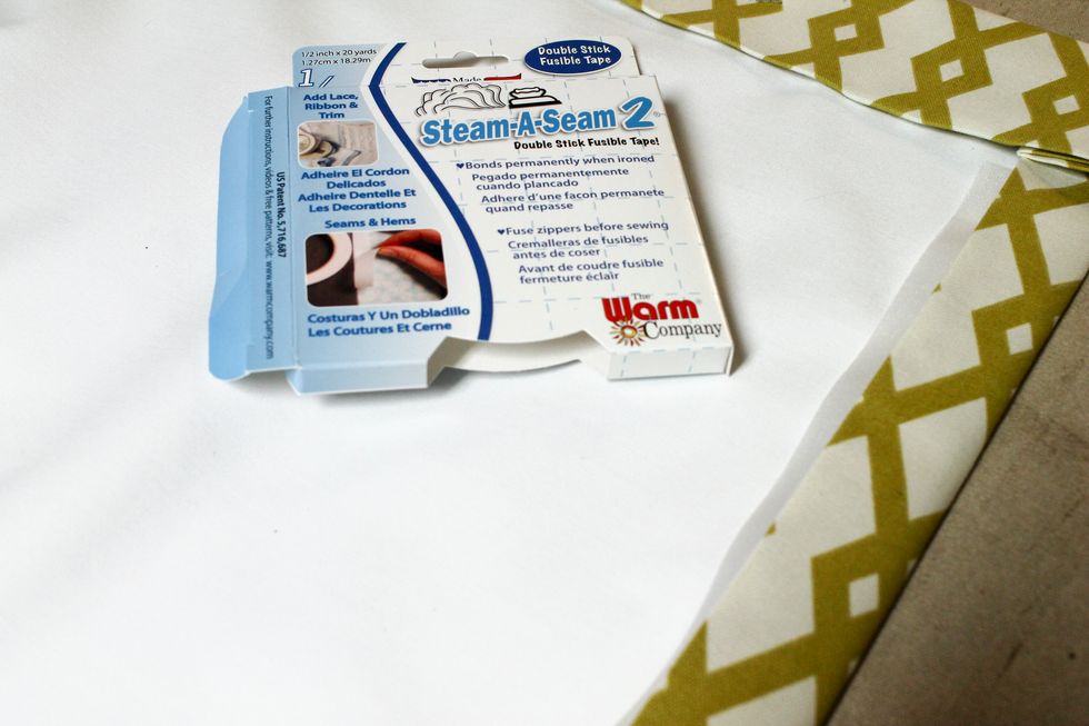Measure the entire length and cut 2 pieces of SteamASeam2 (available here http://bit.ly/2xbRKSV) the appropriate length. Slip it under the edge of each of the side hems and press