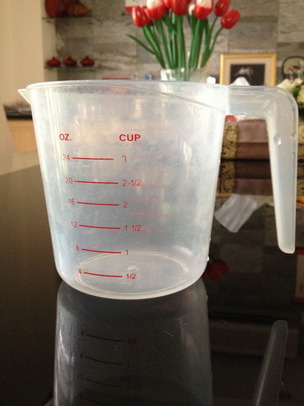 Measure the ingredients to the right amount: 2 cups of orange juice , A cup of ripe mango, and pineapple chunks. Half a banana , 2 cups of frozen strawberries, a Tbs of sugar, and lastly 2 cups of ice