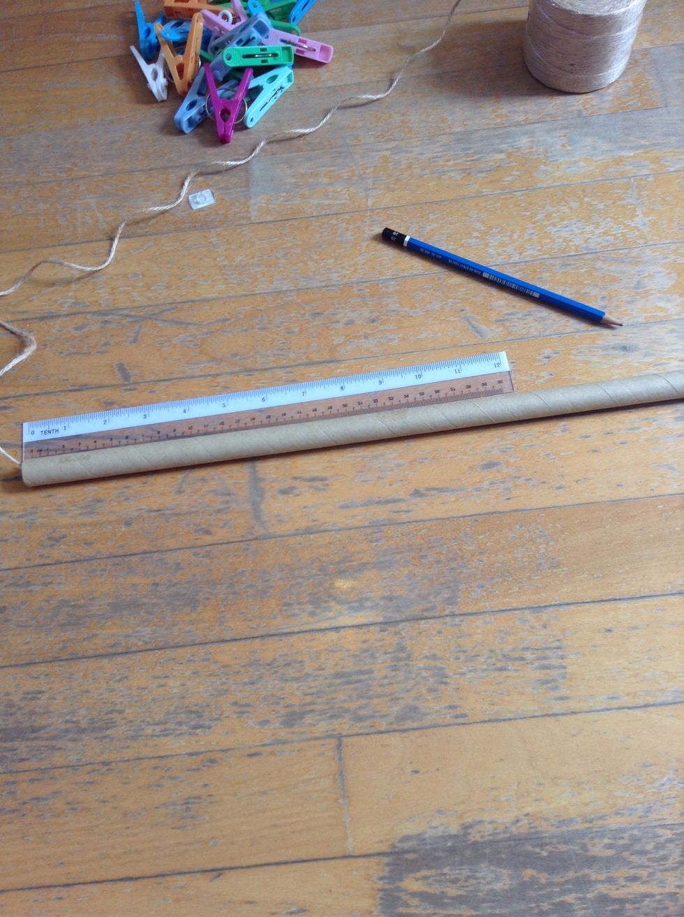 Measure the length of your rod. Divide the length by 2 and mark the center. Measure the string to a length that is slightly longer than the length of the rod (depending on how much u want it to hang).