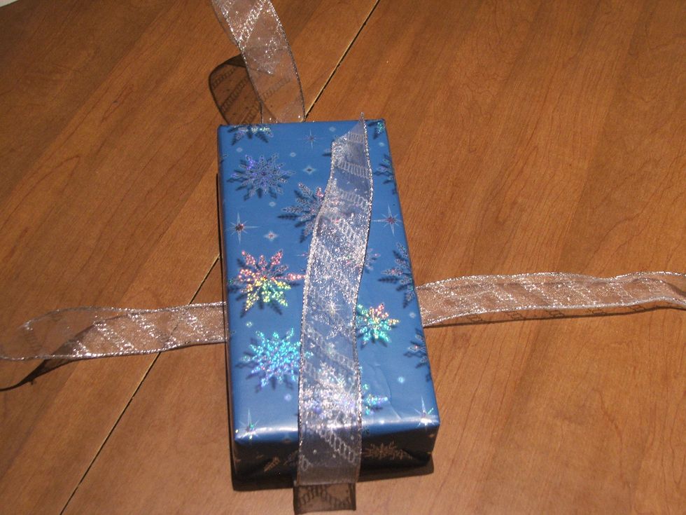 Measure the Ribbon vertically and horizontally  to Wrap around the box.