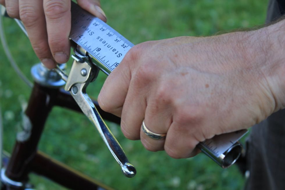 Measure the section of the handle bar you want your grip to cover.  Hold a ruler under your hand and against the bar for accurate measurement. Be sure the measurement will apply to both sides.
