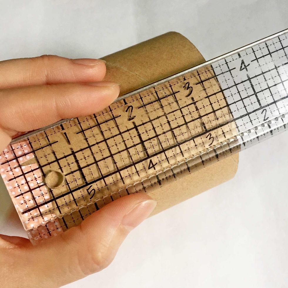 Measure the toilet roll using a ruler to give an estimation on how long is the height of the jar. For this roll, the height is ~3.5".