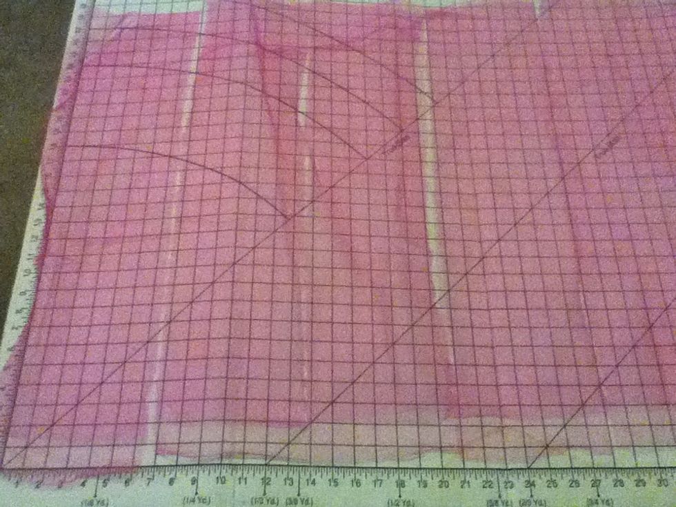 Measure the tulle into 7 inch segments, and cut. If you don't have a board like this to measure on, use a measuring tape, and pin it to mark every 7 inches.