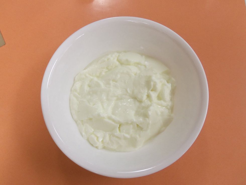 Measure two cups of plain nonfat yogurt into a bowl.
