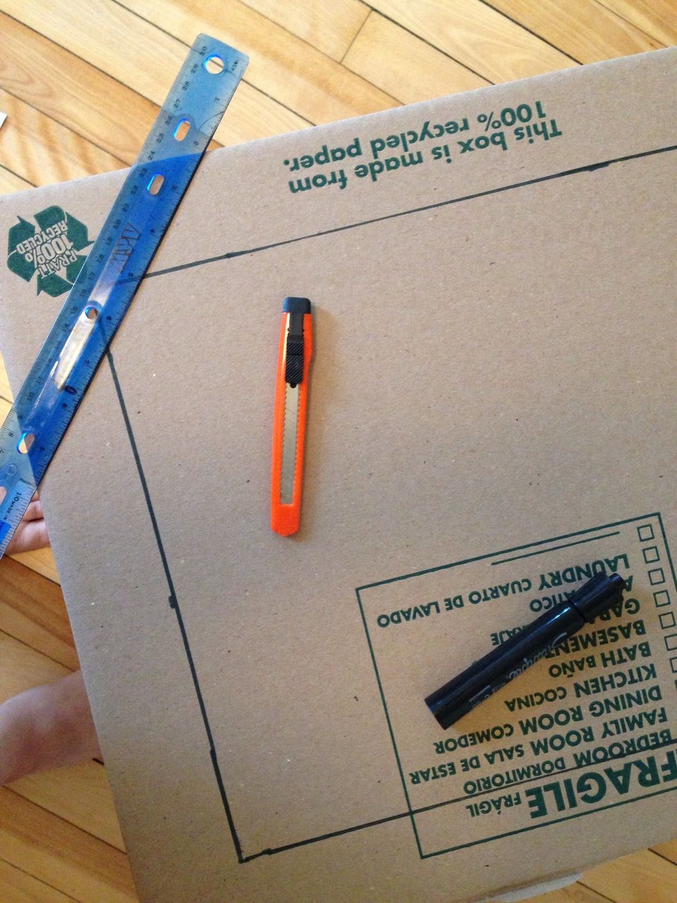 Measure two inches around 3 sides of the box and cut it out. Don't cut the bottom and one side of the box.
